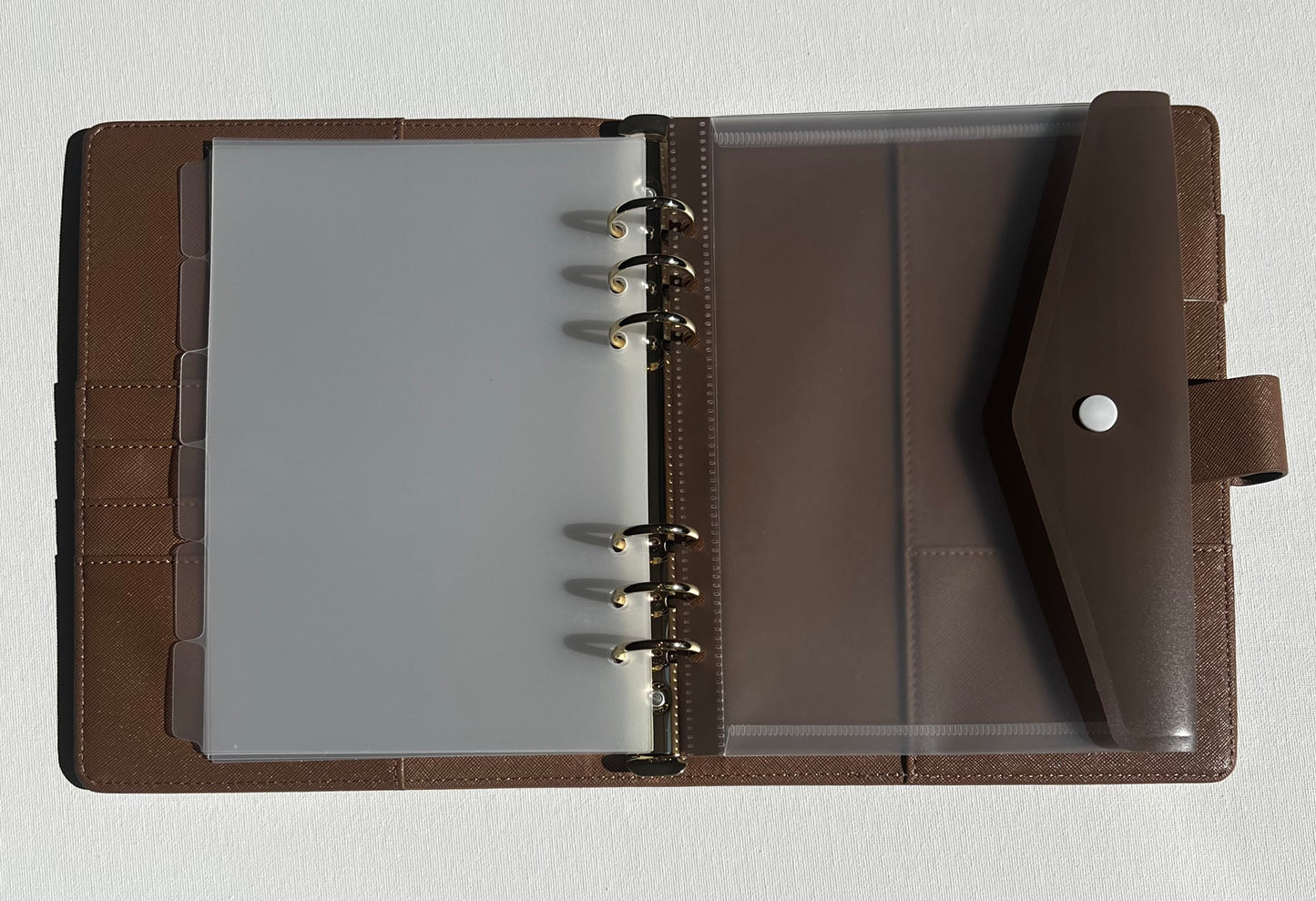 Brown leather parent organiser with clear A5 divider tabs and a clear A5 folder with brown flap