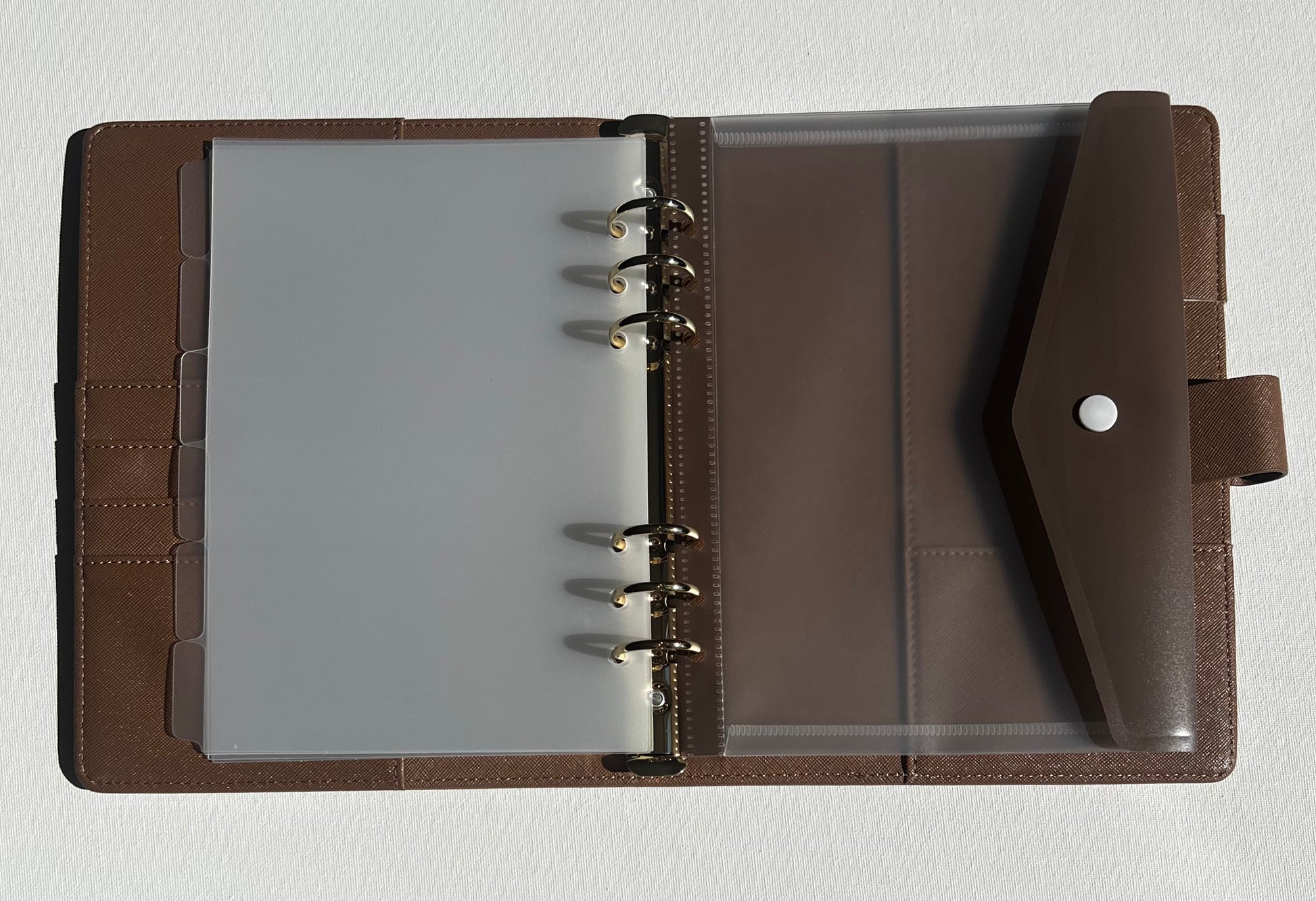 Brown leather parent organiser with clear A5 divider tabs and a clear A5 folder with brown flap